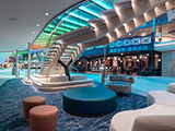 The guest services area on Royal Caribbean’s Icon of the Seas is also illuminated with the help of Hella marine LEDs. 