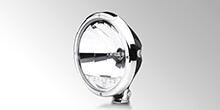 Rallye 3003 auxiliary high beam headlamp by HELLA with LED position light and chrome design ring.