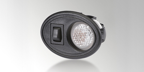 Spot de lectura para montaje interior en tecnología de lámpara incandescente, con lente transparente, con lámpara e interruptor integrados, carcasa con forma ovalada, en negro, de HELLA