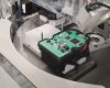 A machine assembles the electronic components of the driving dynamics control system