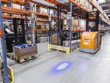 The LED's luminous flux is pooled so that a circular warning spot is projected onto the ground approximately two to three meters in front of and behind the forklift