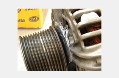 Damaged alternator housing due to worn bearing